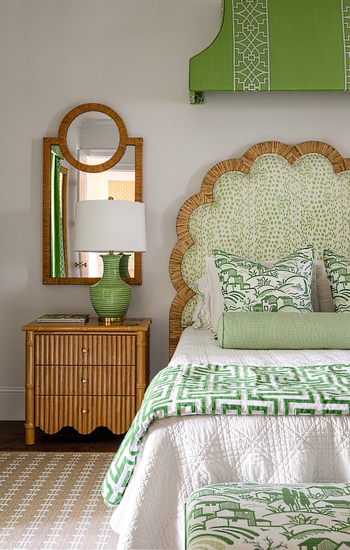 Luxury bedroom in Davis Shores featuring a patterned headboard, woven textures, and soft linen bedding.