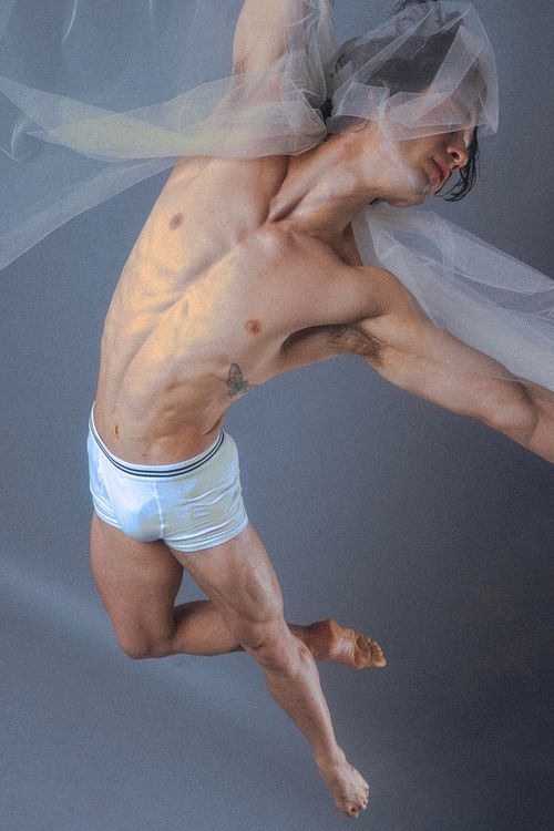 Editorial fashion image, model in motion, studio lighting, photographed by Mila Filippone.