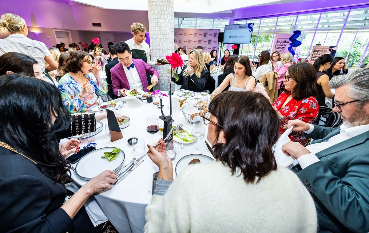 Attendees start dining around a table at the Ragtrader, Australian Fashion Industry awards.
