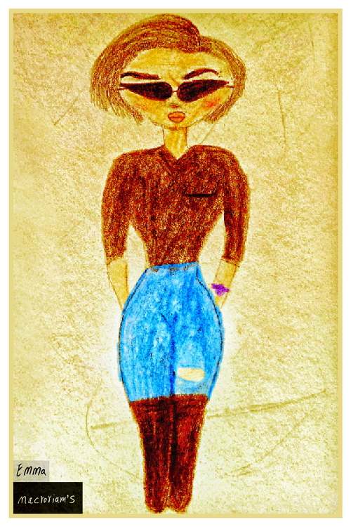 A woman with short hair and sunglasses stands confidently wearing a brown top and ripped blue jeans. She has her hands casually in her pockets.