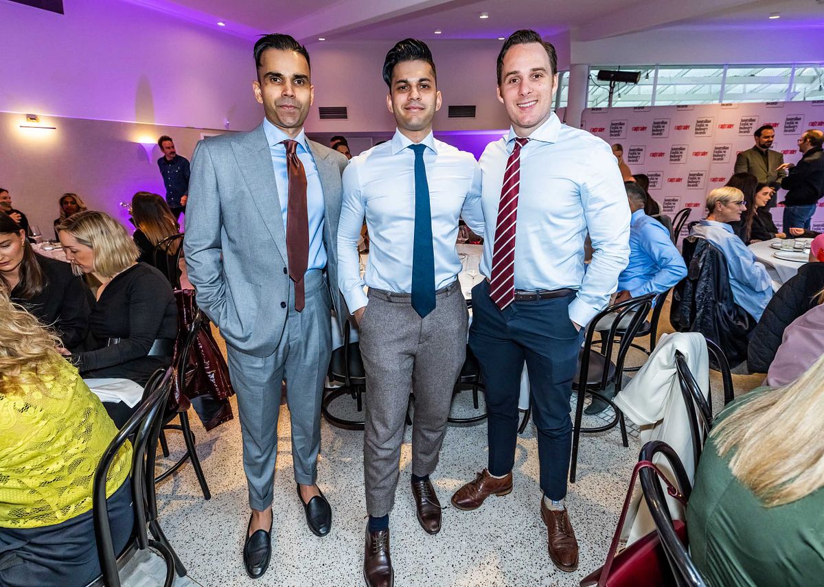 Three men pose for a photo at the Yaffa Media &ndash; Ragtrader, Australian Fashion Industry Awards.