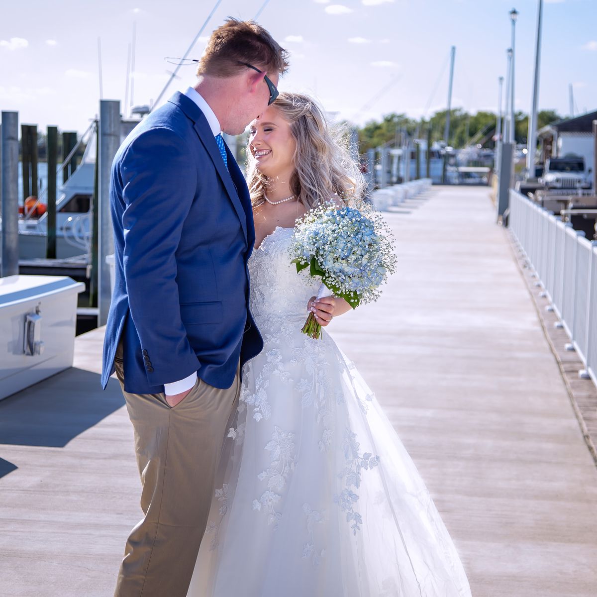 Relaxed coastal wedding celebration imagery near Lewes, Delaware, featuring a candid moment with the bride and groom.