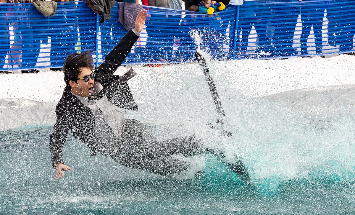 Business Professional Taking Unexpected Plunge into Pool