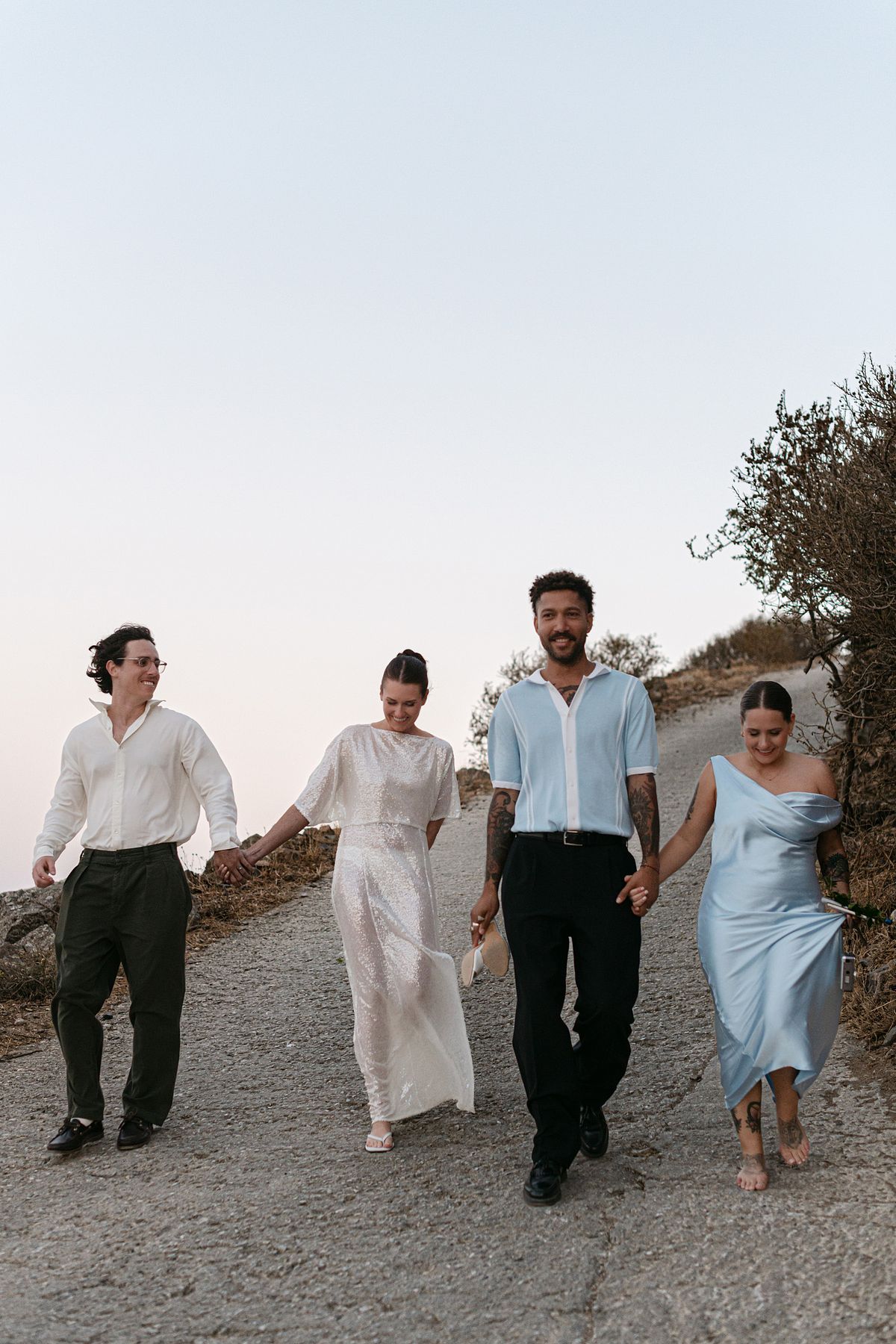 romantic wedding couple in Paros Greece walking by the sea &ndash; destination wedding photographer Greece, photographe mariage Gr&egrave;ce
