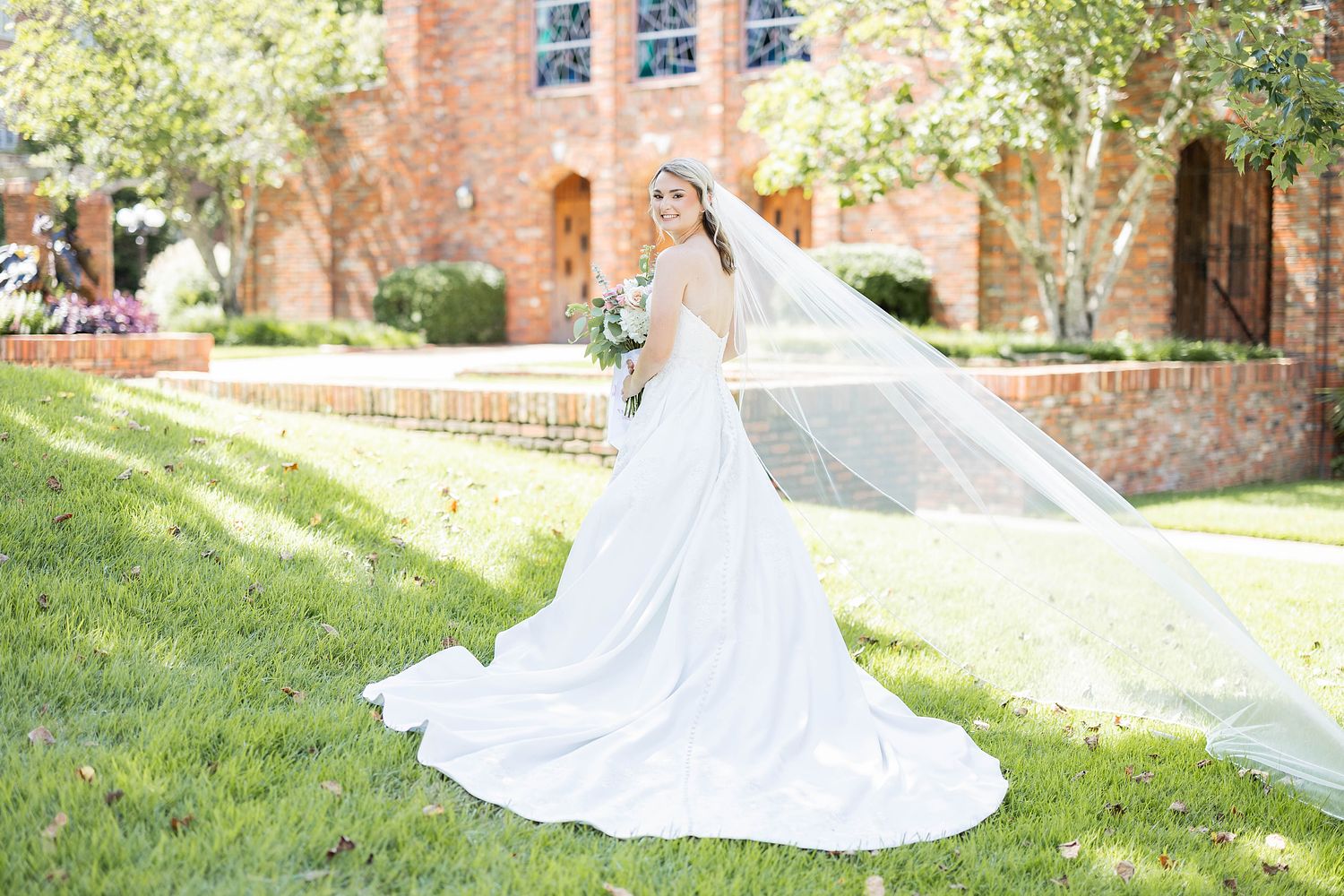 Beautiful Bride posing in front of The Chapel of Memories on Mississippi State University's campus in Starkville MS