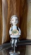 Traditional boy with a fish, little ceramic hanging sculpture
