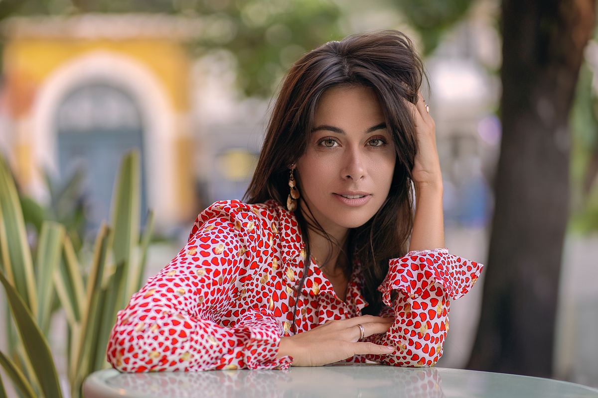 Woman in a red dress during a Lisbon portrait session