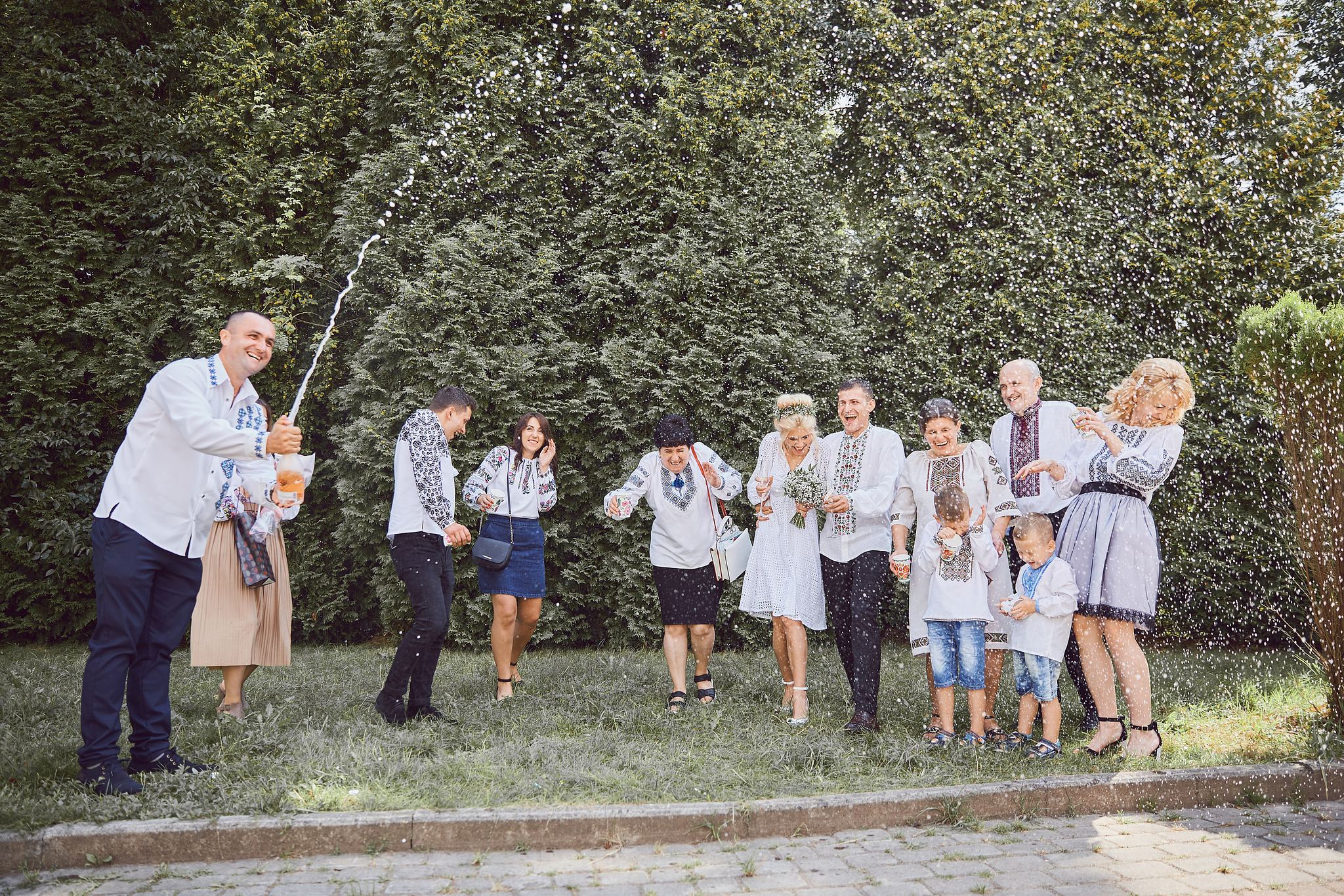 Wedding guests celebrating together with champagne