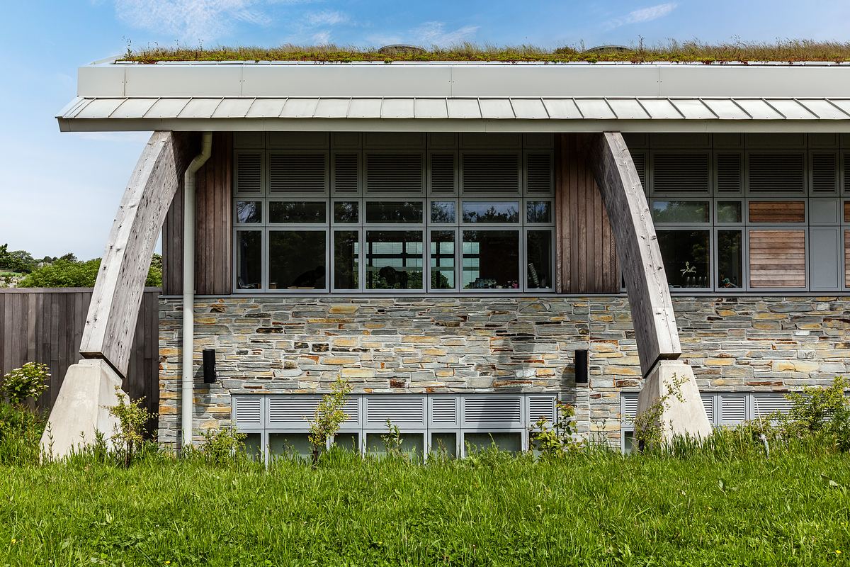 Close-up architectural detail of AIR building in Cornwall, showing natural stone and timber design.