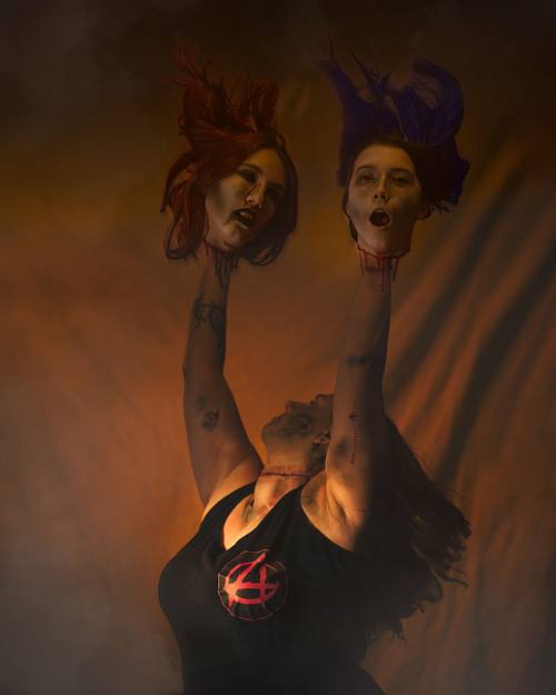 A zombie cheerleader with her severed head pom poms.