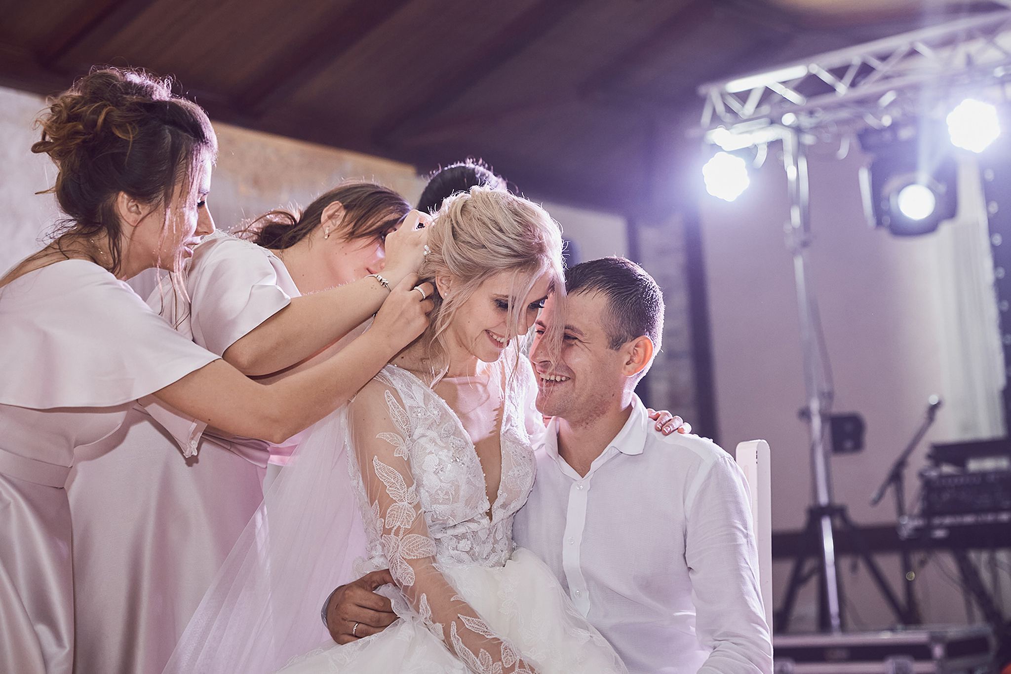 Newlyweds smiling together during their wedding reception