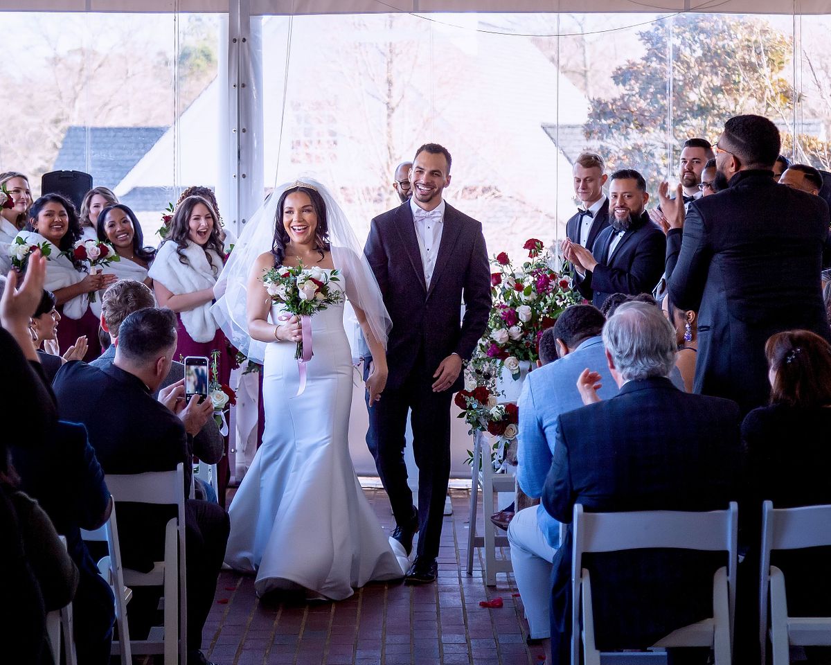 bride and groom leaving the covered porch after the ceremony