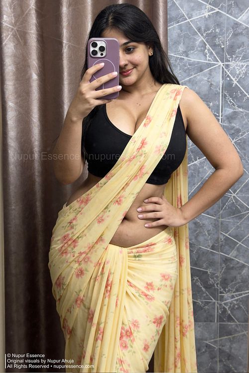 Floral saree mirror portrait featuring Nupur Ahuja