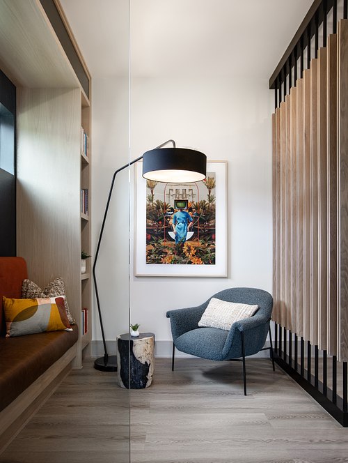 Modern corporate breakout space in St. Augustine, FL, featuring custom wood shelving and bench seating.