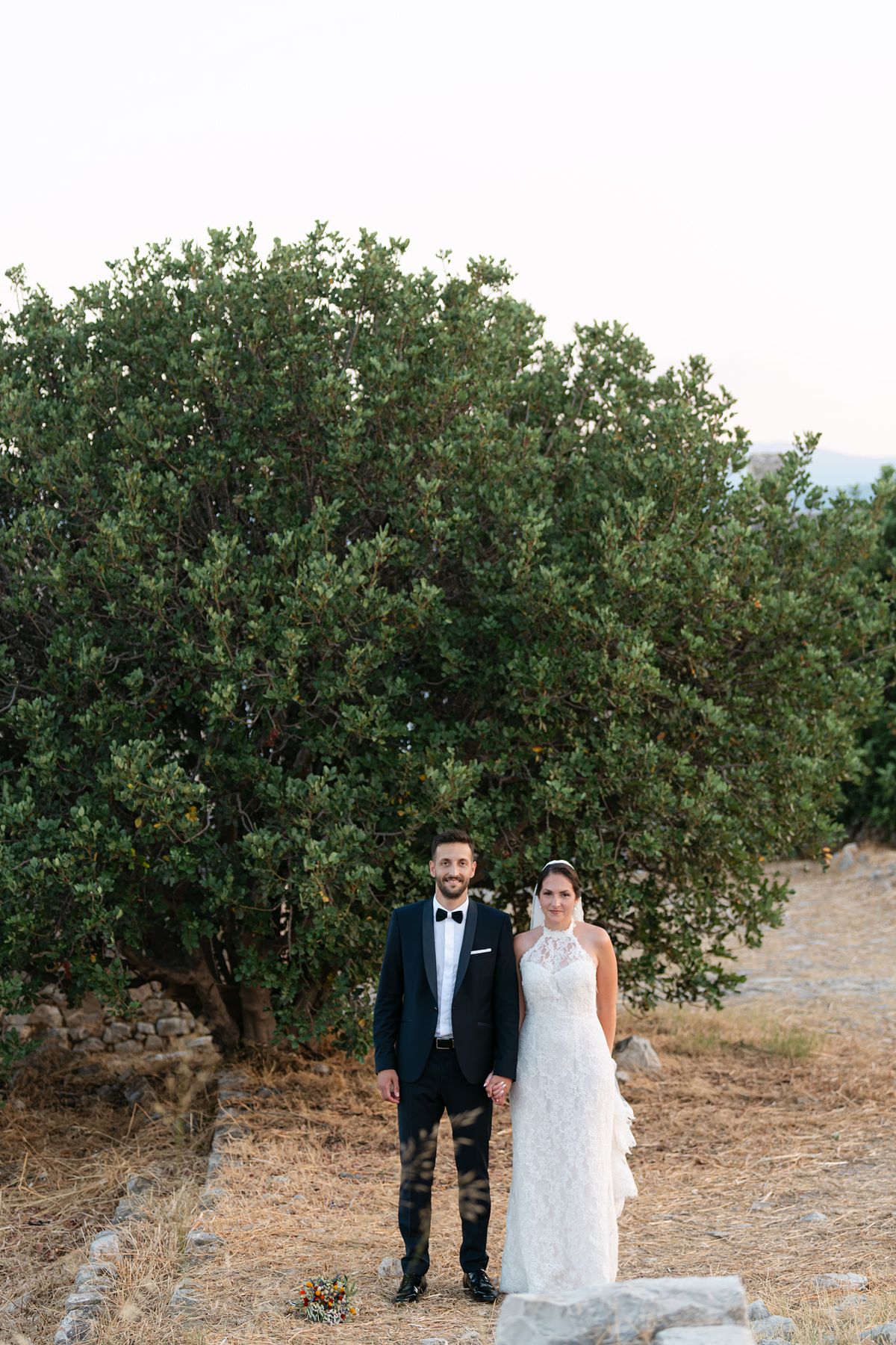 timeless wedding couple portrait in Astros castle Greece &ndash; classic elegant pose destination wedding photographer