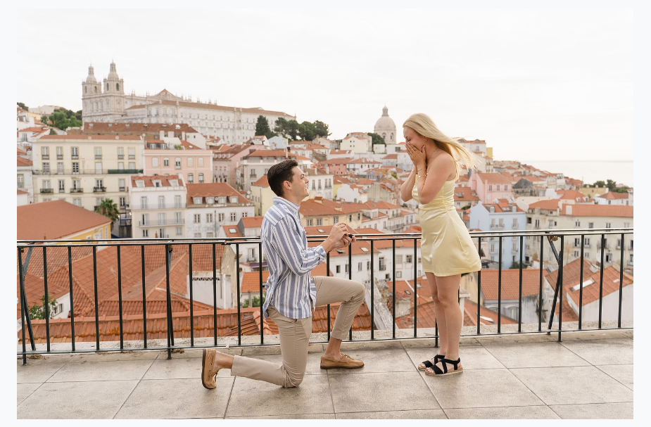 Surprise proposal at a Lisbon viewpoint overlooking Alfama