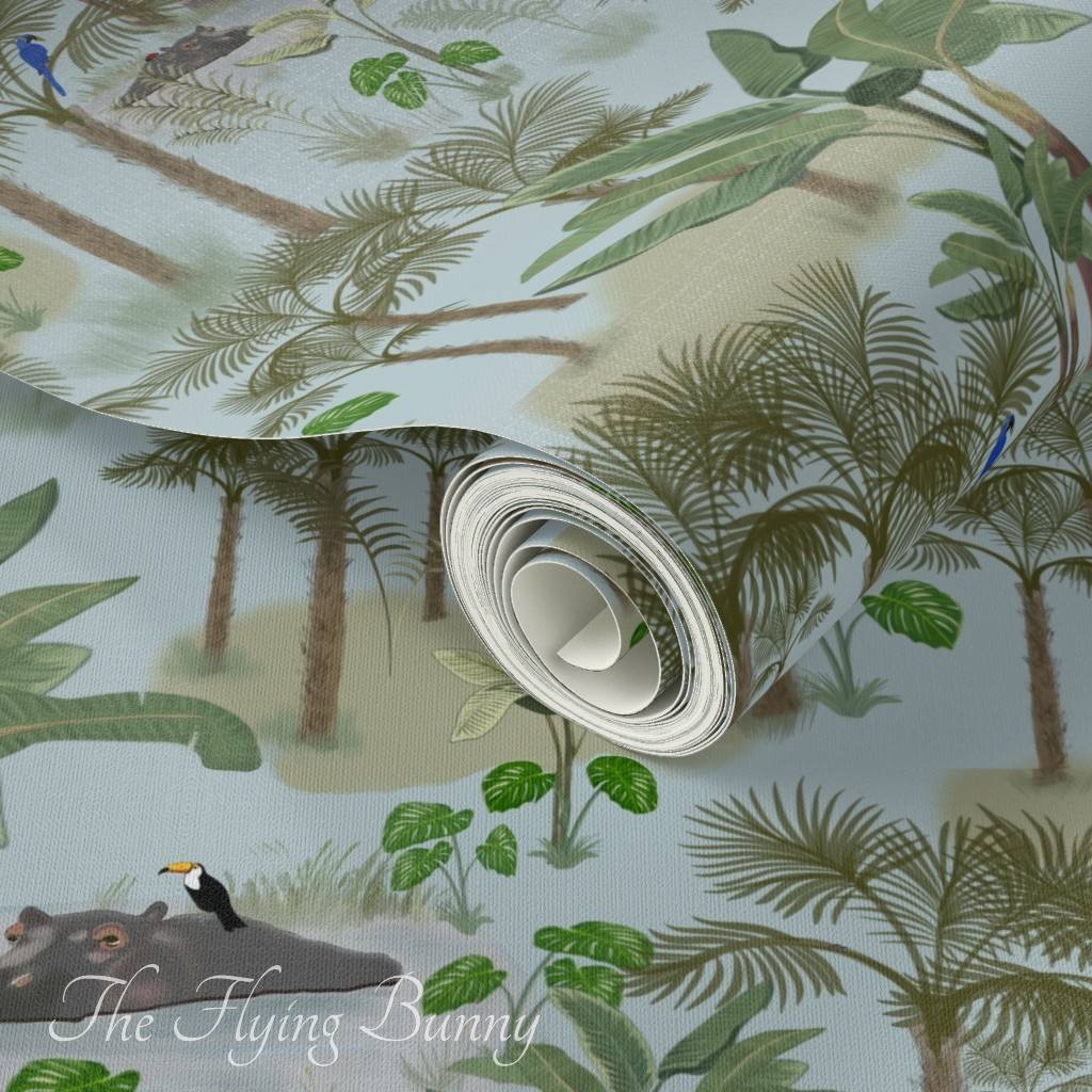 Nursery wallpaper featuring a soft jungle pattern with palm trees, tropical leaves, birds, and playful jungle animals on a pale blue background.