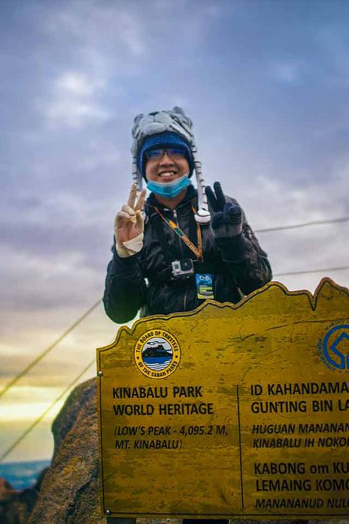 Photograph of me on the peak of Mount Kinabalu.