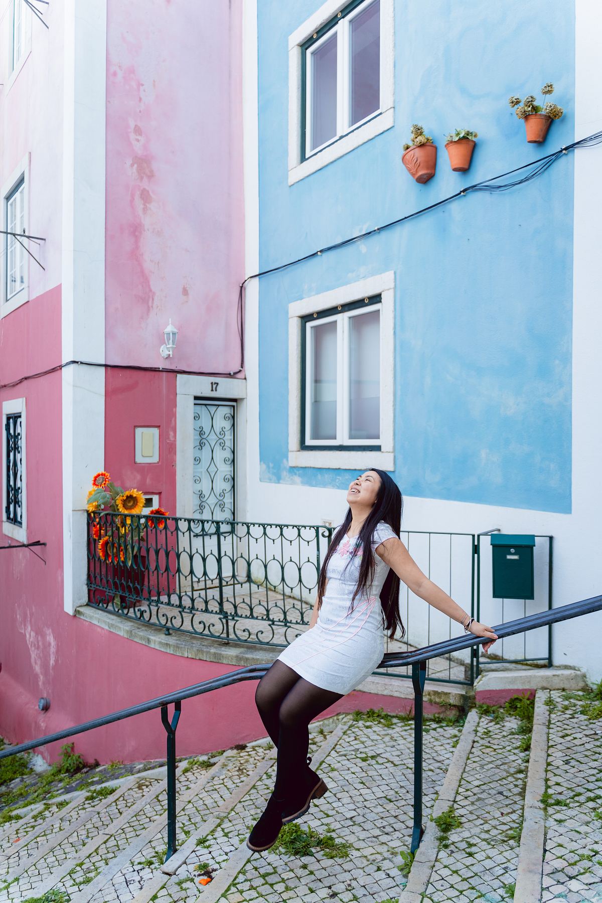 Woman on colourful steps in a Lisbon street