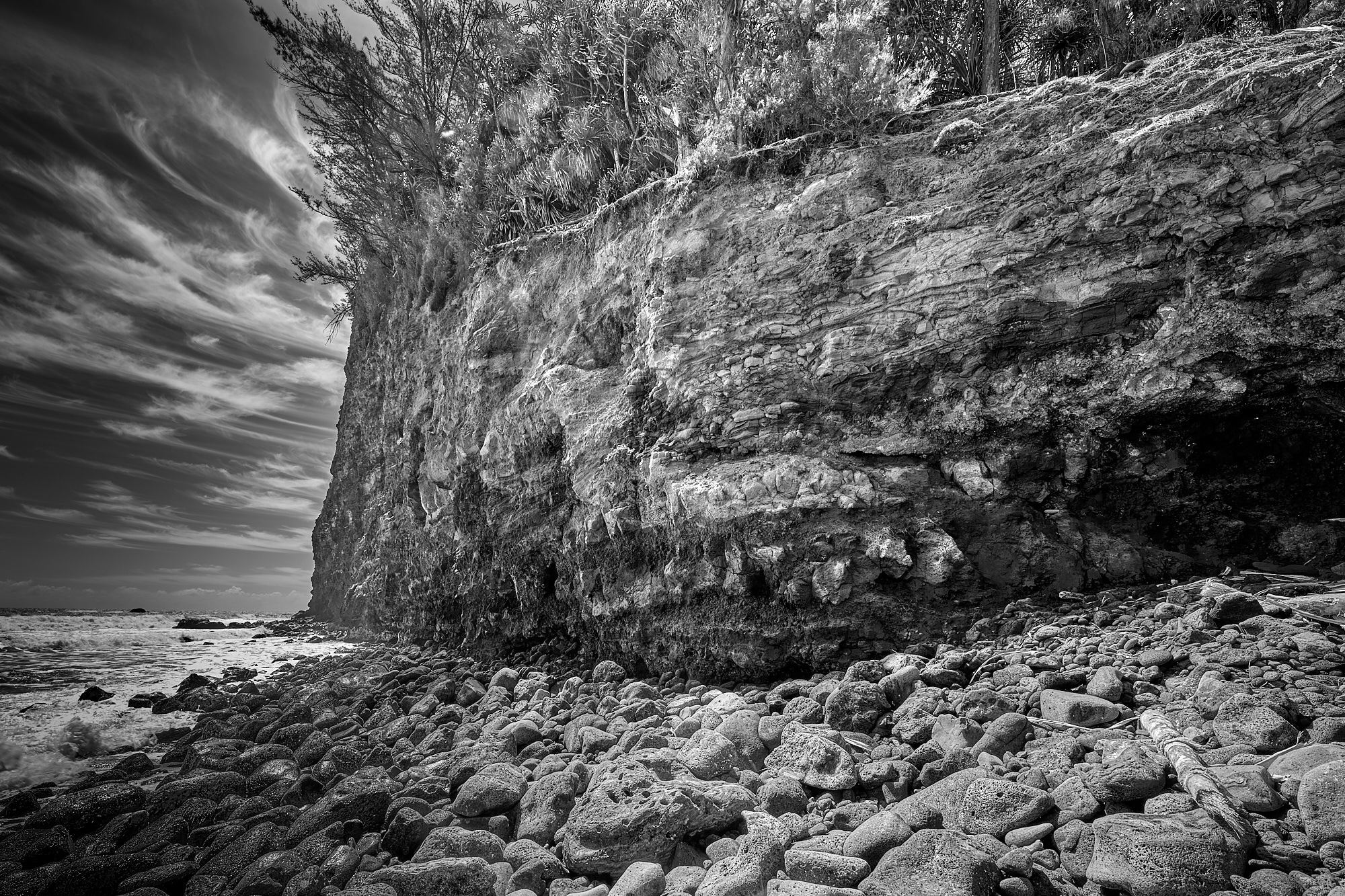 Honokane Nui Cliffs Loom Over Shoreline - Pololu Valley, Hawaii
