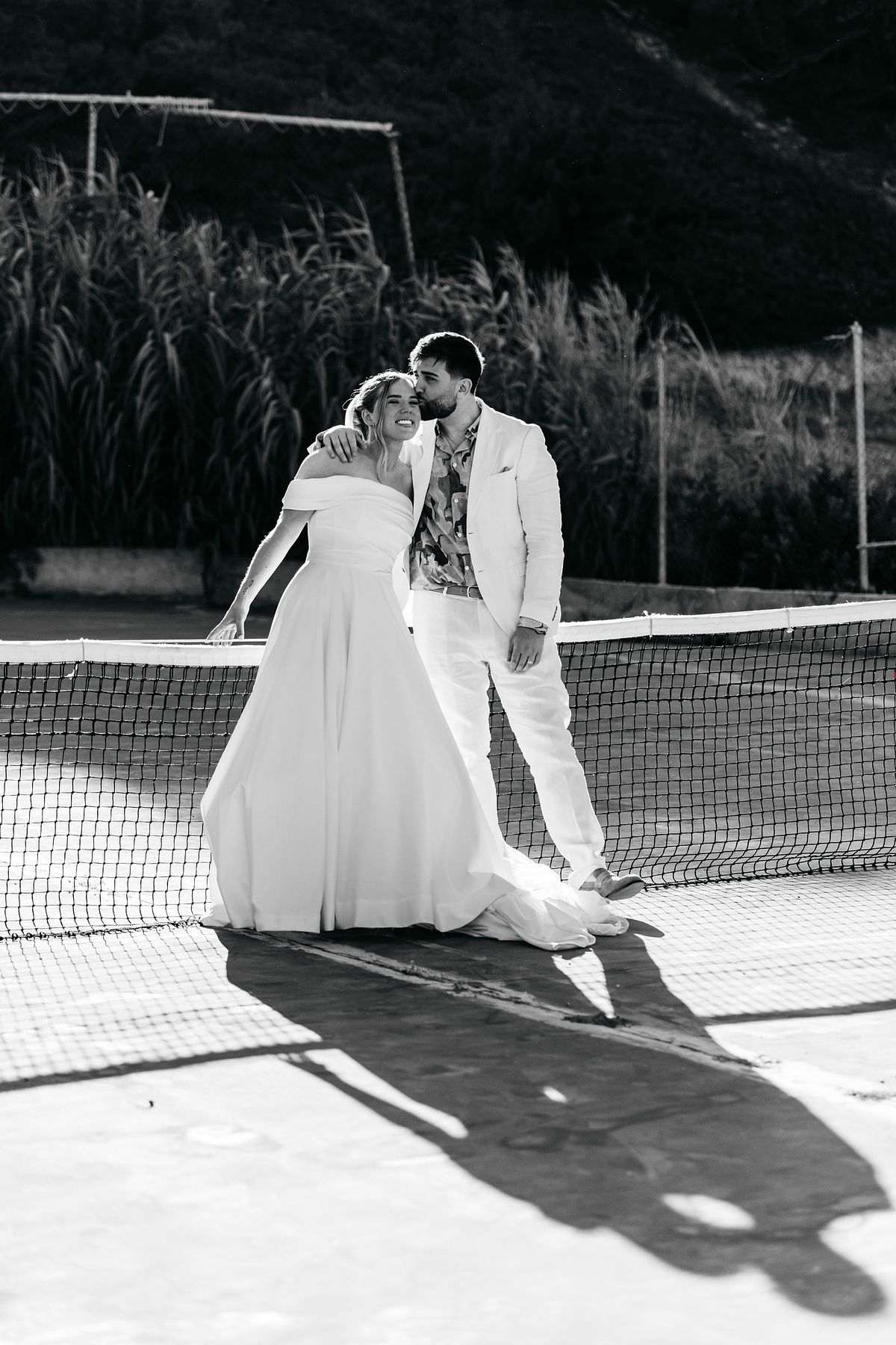 editorial wedding couple portrait on tennis court in Greece &ndash; modern destination wedding photography stylish couple