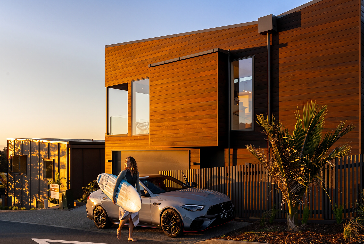 Twilight architectural photography of a modern home at West Village, Rangitahi Peninsula, Raglan, captured by Flax Cove Studio.