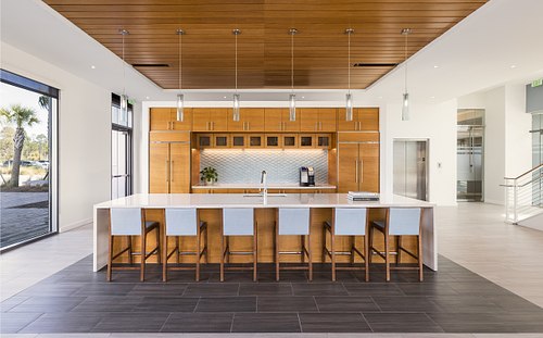 Modern commercial kitchen and breakroom interior at the FPU Headquarters in Yulee, Florida, designed by Polk Stanley Wilcox Architects.