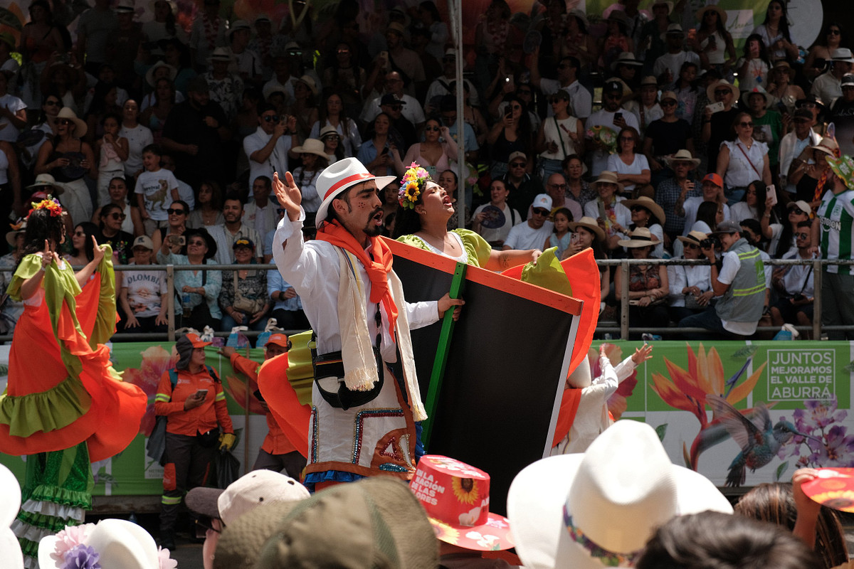 Dancers in traditional Antioquian dress performing at a Feria de las Flores parade in Medellin