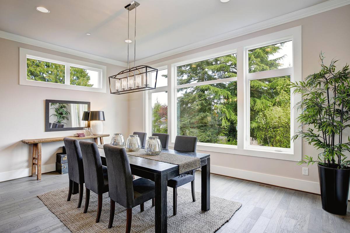 Luxurious modern dining room boasts a black dining table