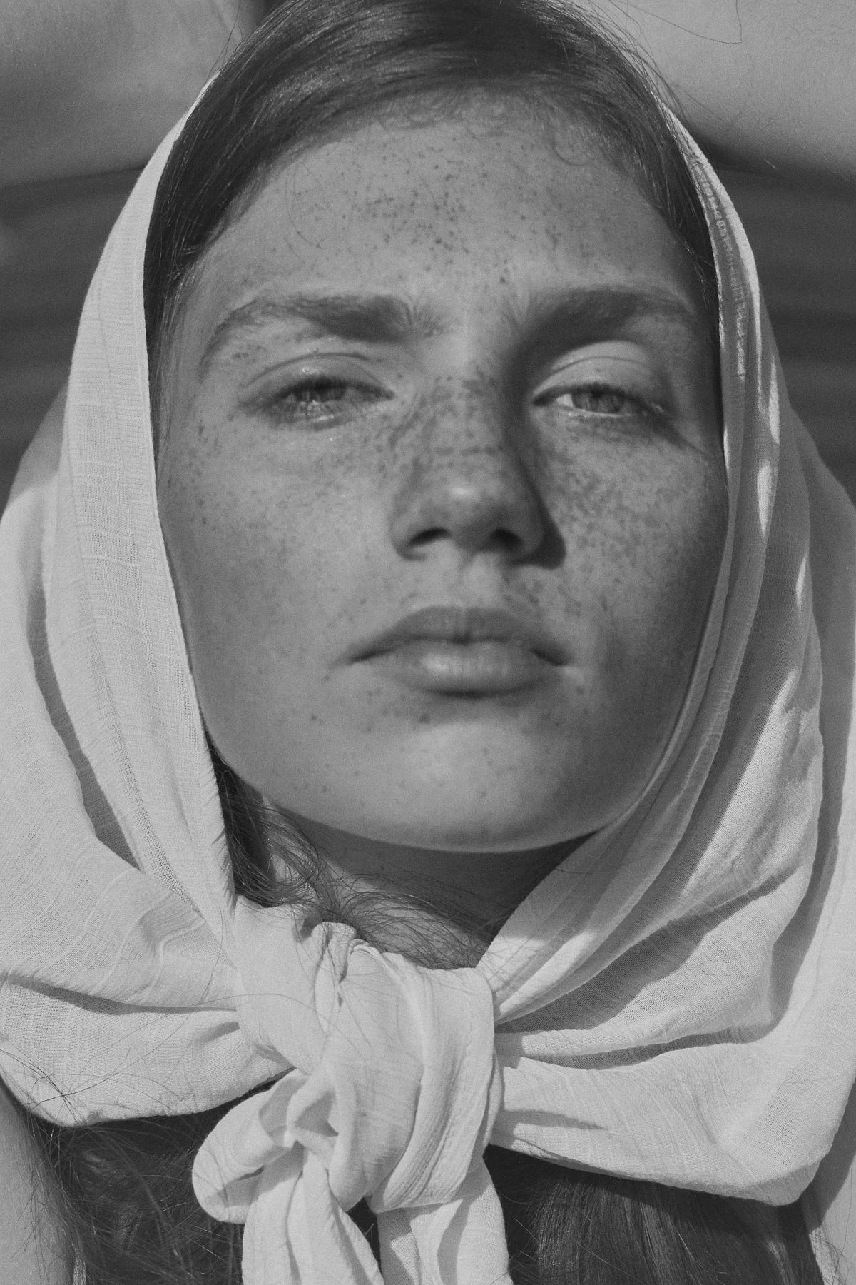 Black and white fine art portrait of a woman with headscarf in timeless cinematic style, Pure Models Prague, by Gabriel Matula.