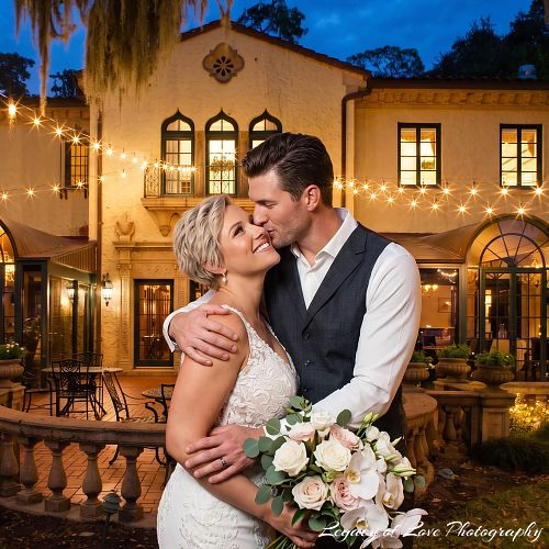 Bride and groom embracing at Epping Forest Yacht & Country Club in Jacksonville at dusk