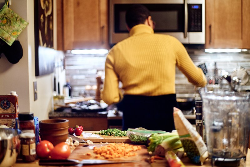 Marcela cooks.