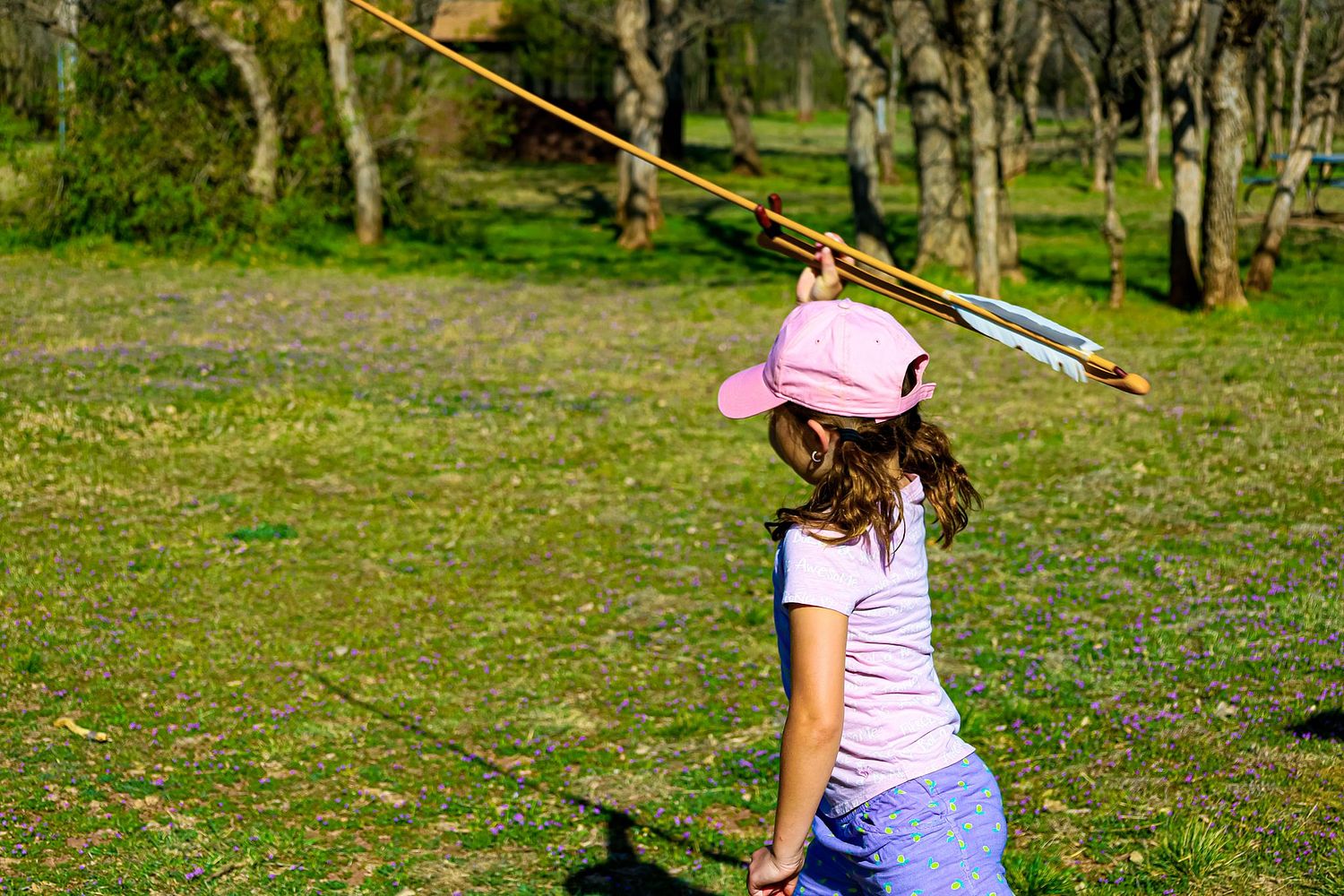 A picture of a girl playing a replica of a Native American game at Copper Breaks State Park, Childress TX.