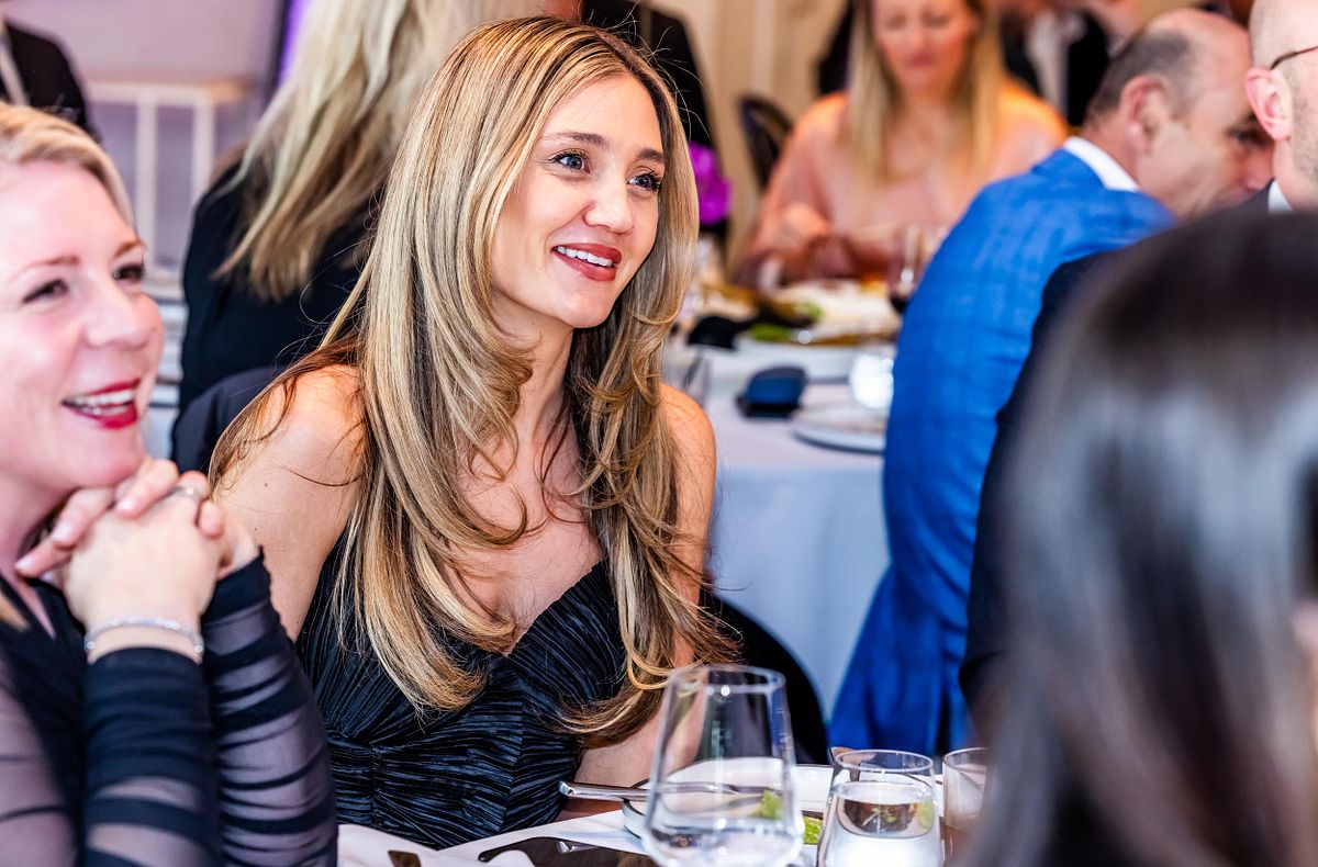 A woman watches sproceedings at the Yaffa Media &ndash; Ragtrader, Australian Fashion Industry Awards.