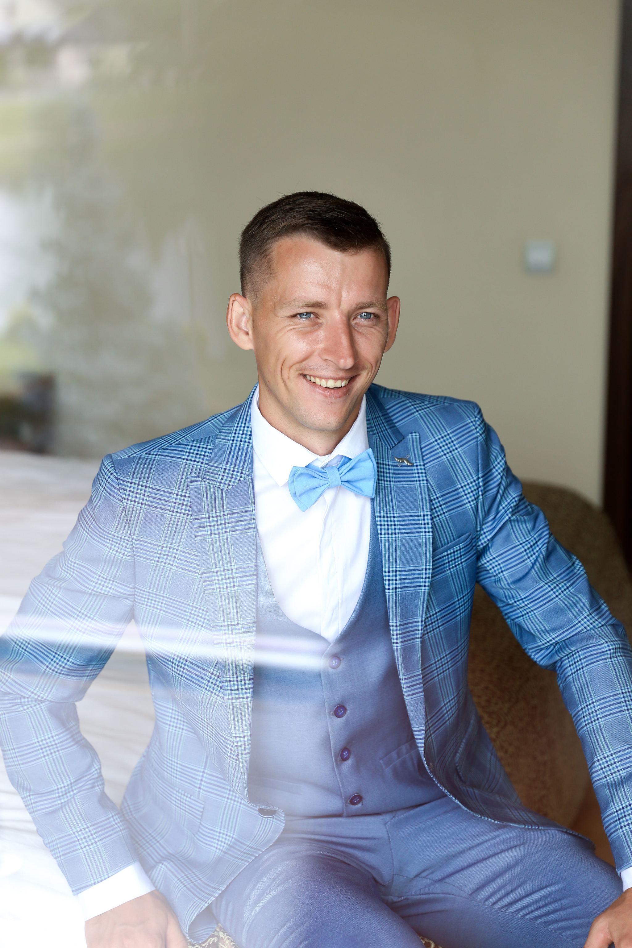 Groom getting ready on the morning of his wedding in Ukraine