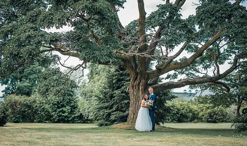 Newlyweds laughing together during their Ottawa wedding day portraits