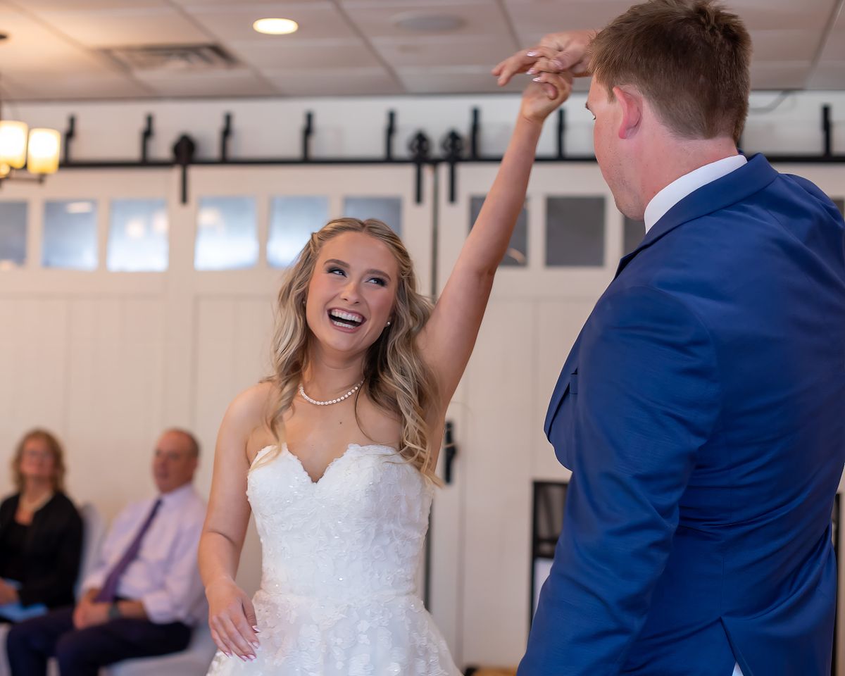 candid moment during first dance at the Irish Penny in Lewes, DE