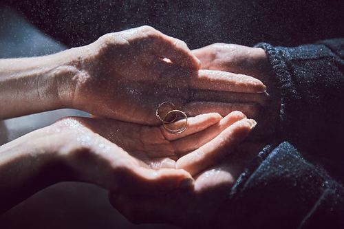 Wedding rings held in hands during a Pidhirtsi wedding