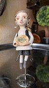 Traditional boy with a fish, little ceramic hanging sculpture