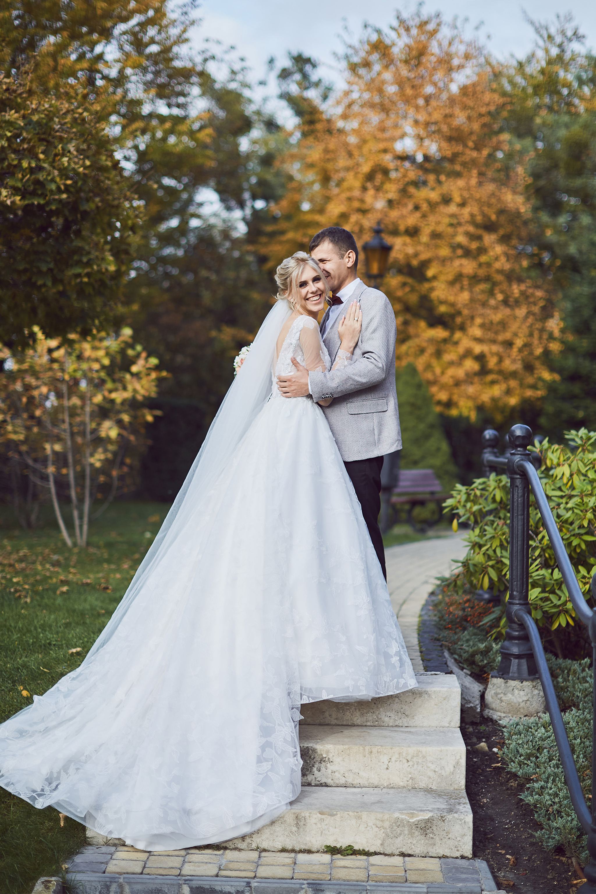 Bride and groom embracing on the garden steps at Citadel Inn