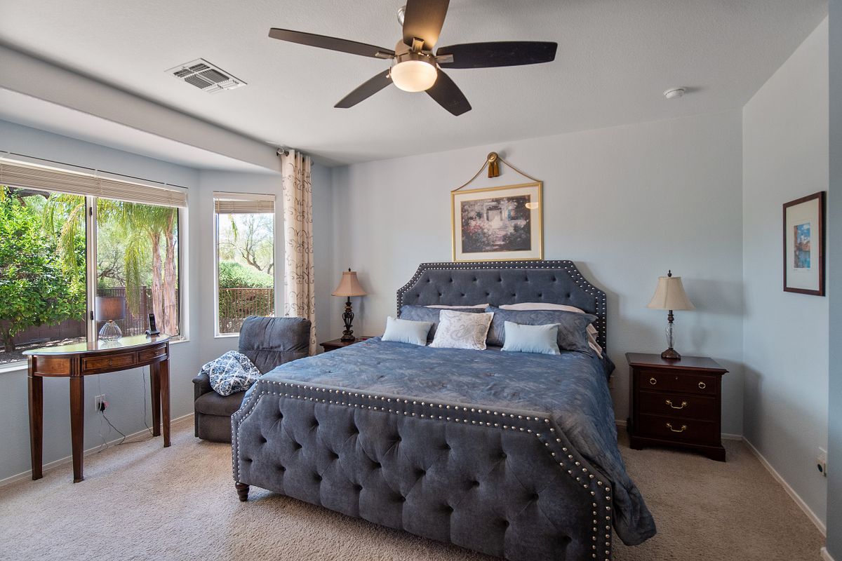 Contemporary bedroom with tufted king size bed in a Loveland Colorado home