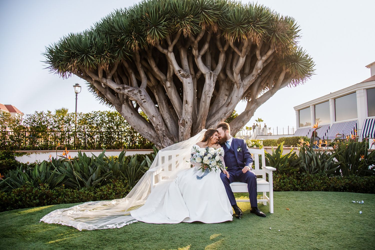 Bride and groom sharing a quiet moment in the gardens at Hotel del Coronado in San Diego