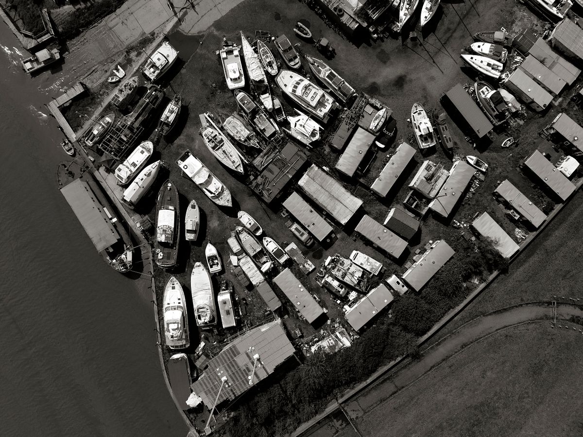 Black and white aerial photograph of the boatyard and moored boats at Benfleet, Essex, viewed directly from above.