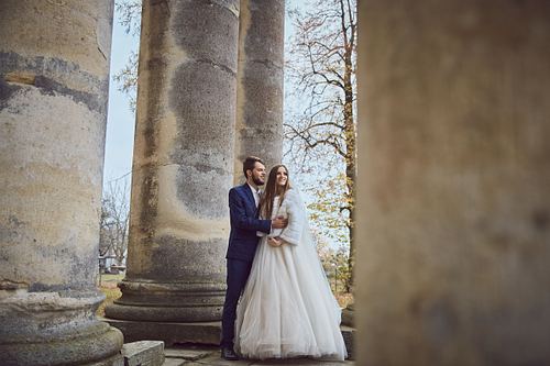 Romantic bride and groom portrait near Pidhirtsi Castle