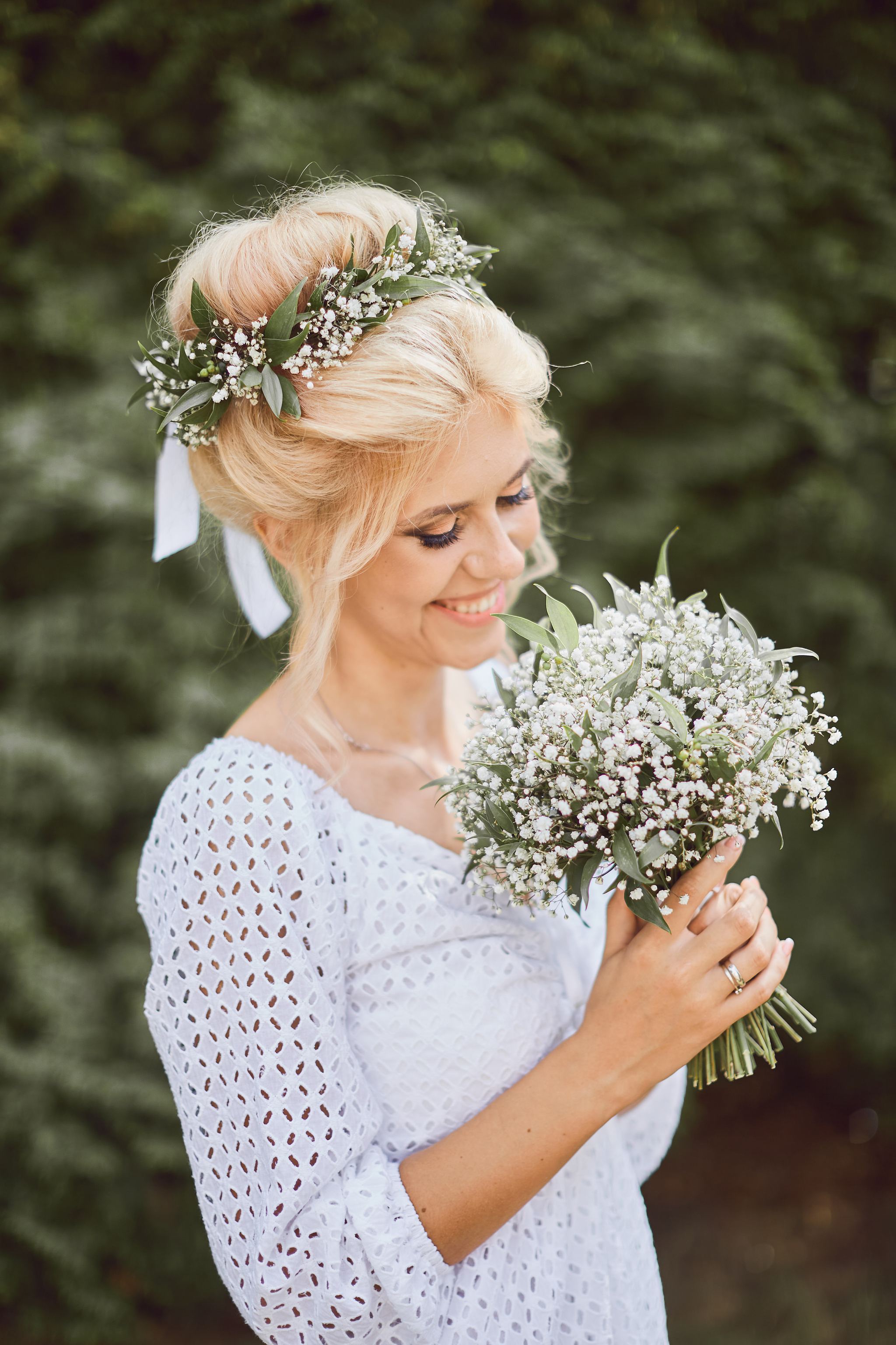 Bride holding her bouquet and smiling
