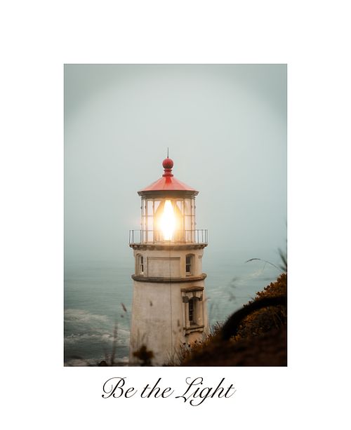 Up close fine art photograph of a Pacific Northwest lighthouse beacon shining directly towards the camera against a moody sky.