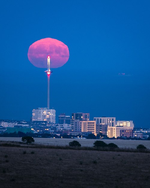 Buck Moon rising over the Brighton i360