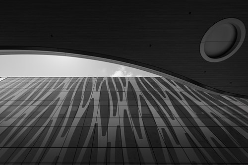 Black and white view of the One Performance Plaza fritted glass facade in Lake Nona Town Center, designed by HuntonBrady Architects.