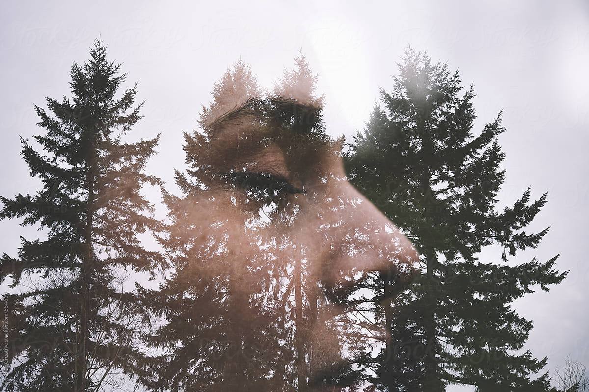 Double Exposure Of Woman And Trees