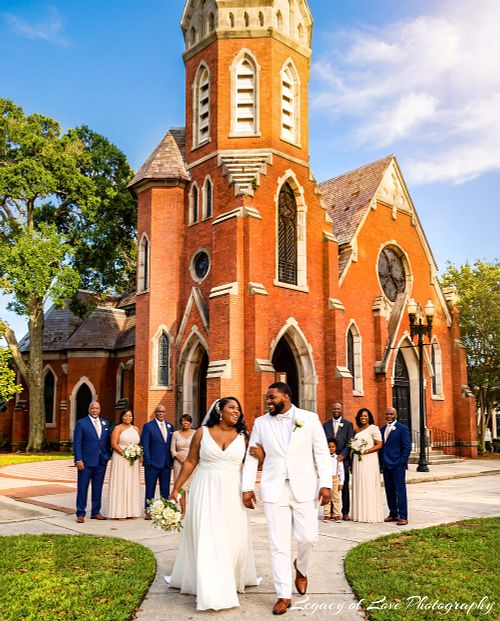 Bride and groom standing in front of Old St. Andrew's Church in Jacksonville after their wedding